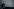 Sophie Verbeeck blickt vor einer weißen gefliesten Wand nach oben.
