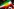 Eine Kurdische Flagge, bestehend aus drei horizontalen Streifen, in von oben nach unten grün, weiß und rot, mit einer gelben Sonne in der Mitte.