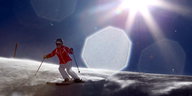 Ein Mensch fährt auf Ski einen Berg herunter