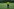 Der Torwart des Panter FC der taz - mit gelbem Trikot und der Nummer 1 steht mit dem Rücken zum Tor