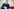 Andreas Büttner sitzt im Brandenburger Landtag, sortiert Papiere und schaut skeptisch in die Kamera