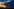 Windpark bei Sonnenuntergang vor Wolkenhimmel