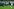 Im Vordergrund ein enttäuschter Wolfsburger Spieler mit hängendem Kopf, im Hintergrund jubelnde Paderborner Spieler