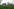Zwei Häuser an einem Feld