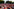 Lange Tisch und Bankreihen voller norwegischer Fußballfans