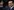 Silvio Berlusconi mit einerm Glas Sekt in der Hand
