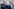 Friedrich Merz formt die Hände, um seine Stimme zu verstärken; daneben Spahn