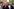 Özgur Ozel (rechts) steht mit anderen Männern vor einem Gebäude, alle haben einen ernsten Gesichtsausdruck