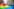Demonstrierende halten eine große Regenbogen-Flagge
