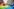 Demonstrierende halten eine große Regenbogen-Flagge