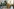 Zwei vermummte Soldaten im Camouflage-Look sitzen auf einem Panzer und schauen in die Kamera Foto: rechts Blick in die Stube eines Soldaten, mit Schränken aus hellbraunem Furnierholz