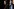 Alexandria Ocasio-Cortez spricht bei einer Pressekonferenz in Washington. Im Hintergrund steht Senator Bernie Sanders.