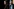 Alexandria Ocasio-Cortez spricht bei einer Pressekonferenz in Washington. Im Hintergrund steht Senator Bernie Sanders.