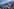 Fans auf der Tribüne, im Hintergrund Bergpanorama