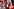 Viele Anhänger der Partei Die Linke Berlin stehen auf einer Bühne und feiern