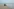 Menschen auf dem Motorrad am Strand