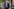 Jens Spahn geht im blauen Anzug mit Krawatte durch eine Tür