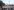 Menschen am Kopf eines Demonstrationszuges tragen ein Transparent mit der Aufschrift "Stop russian occupation in Oleschky"
