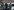 Vermummte Polizisten der Bundespolizei führen einen Mann in Handschellen ab
