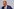 Friedrich Merz vor hellem Hintergrund mit Brille, Halbglatze und blauem Anzug mit Krawatte pustet vor sich hin - er wirkt erschöpft