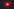 Nacht, Bremslicht eines im Straßenlicht schimmernden Tesla