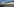Blick auf Gitter vor Zelten
