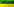 Der Mast einer Hochspannungsleitung steht zwischen einem gelbem Rapsfeld und einem angrenzenden grünen Feld